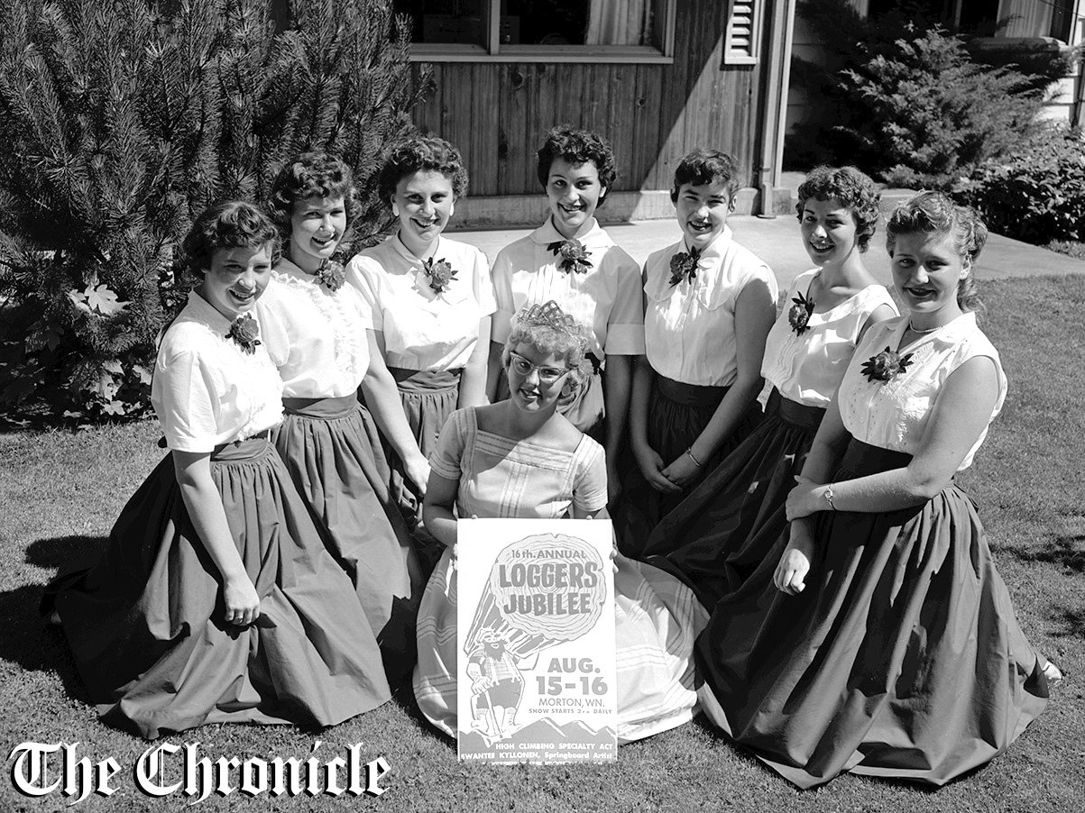 From the July 1959 Chronicle archives: “QUEEN CANDIDATES - Candidates for the title of Morton’s 1959 “Logger’s Jubilee Queen” form a semi-circle around last year’s title holder, Sandy Hansen. The girls, from left, are: Lois Noel, Judy McCready, Terry Peterson, LaVerne Coleman, Virginia Davis, Rosalie McNee and Coral Hall. Two candidates, Sharon Walker and Barbara Baker, were not present when the picture was taken. The girls, one of whom will be named queen August 16, were presented charm bracelets by the Morton Women’s Business club at a luncheon at the home of Mrs. Reg Lester Wednesday. Saturday, they will appear in the Auburn Days parade. - Chronicle Staff Photo.”